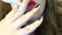 Chubby Brunette Goth Young Smoking White Filter In Red Lipstick Close Up