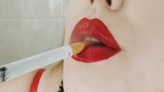 Cigarette Dangling And Smokes Close Up With Red Lips