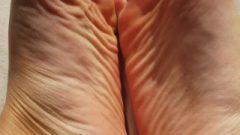 Close Up – Feet Kink – Interlocking Toes – Wrinkled Feet And Pink Nails